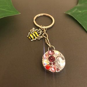 Unique multi colored queen bee key chain.